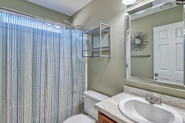 full bathroom with a shower with curtain, toilet, vanity, and a textured ceiling