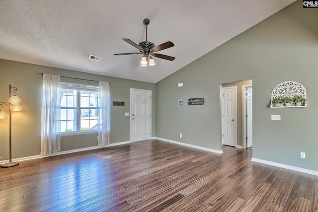 interior space with visible vents, baseboards, ceiling fan, wood finished floors, and a textured ceiling