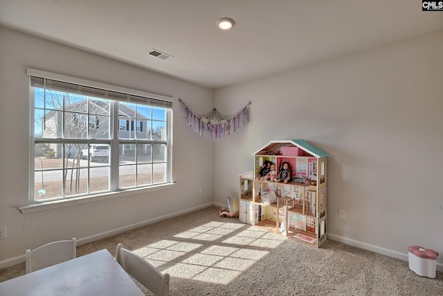 playroom with visible vents, baseboards, and carpet