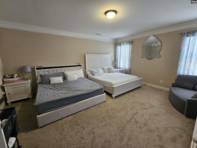 bedroom featuring ornamental molding, baseboards, and carpet floors