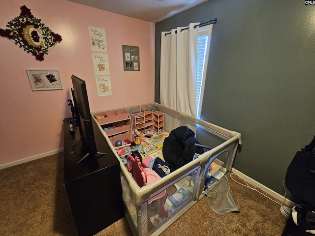 bedroom with baseboards and carpet