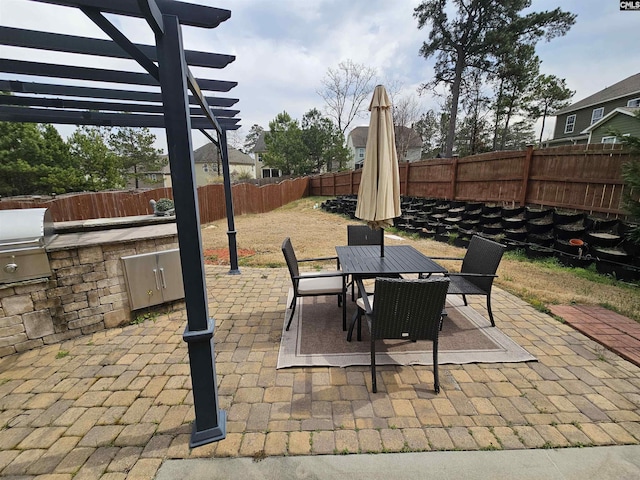 view of patio featuring outdoor dining space, area for grilling, a fenced backyard, and a pergola