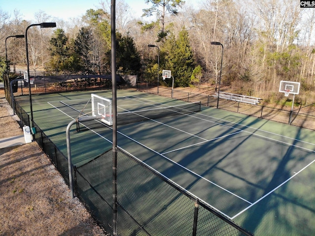 view of sport court with community basketball court and fence