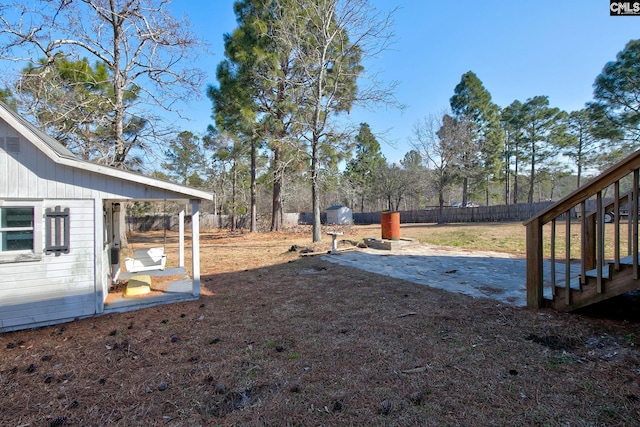 view of yard featuring a patio and fence