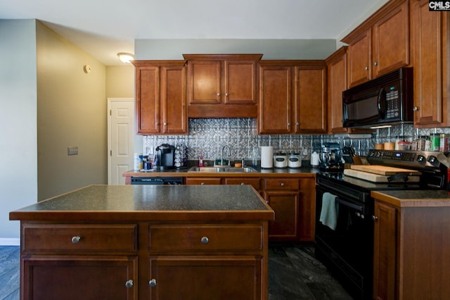 kitchen with a sink, backsplash, dark countertops, and black appliances