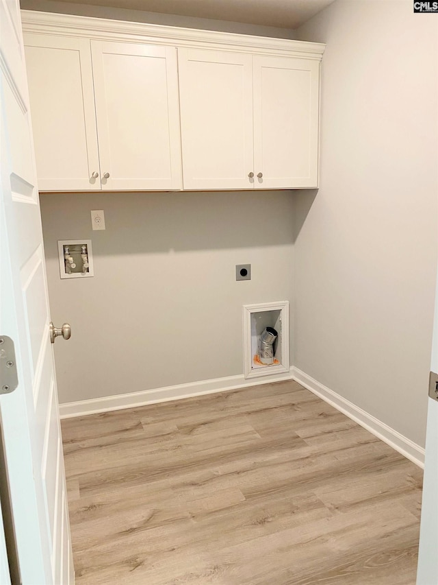 clothes washing area featuring electric dryer hookup, baseboards, washer hookup, and light wood-style flooring