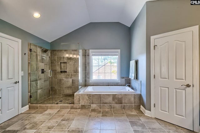 full bath with a garden tub, a stall shower, and vaulted ceiling