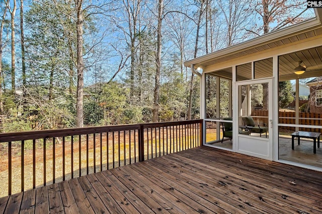 wooden terrace featuring a sunroom