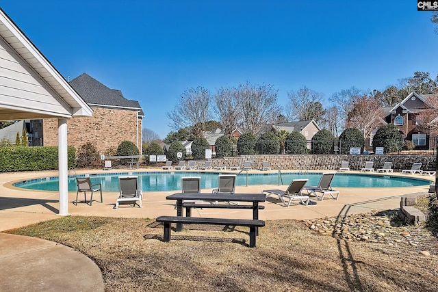 pool featuring a patio and fence