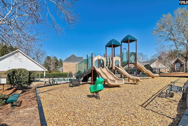 community jungle gym featuring fence