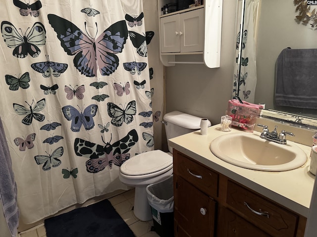 bathroom featuring vanity, tile patterned floors, toilet, and a shower with shower curtain