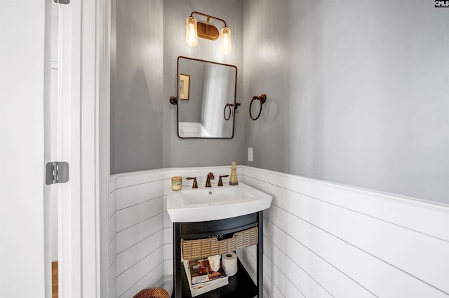 bathroom with wainscoting and vanity