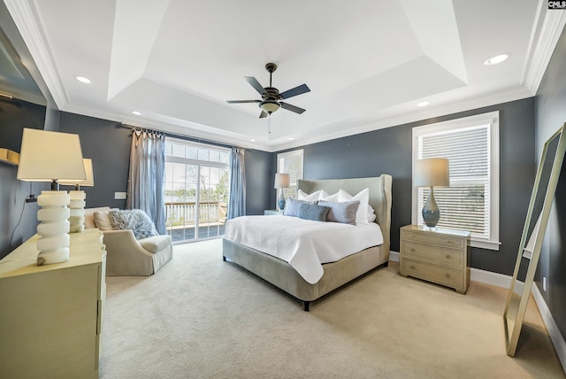 bedroom with access to exterior, baseboards, ornamental molding, carpet floors, and a raised ceiling