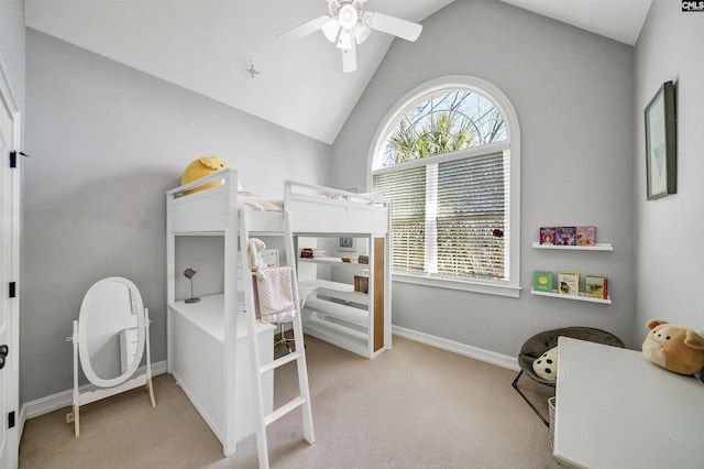 carpeted bedroom with lofted ceiling, a ceiling fan, and baseboards