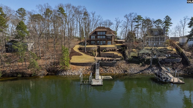 rear view of property with a water view