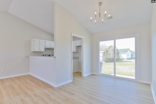 unfurnished dining area with visible vents, baseboards, an inviting chandelier, and light wood finished floors