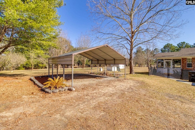 exterior space featuring a detached carport and driveway