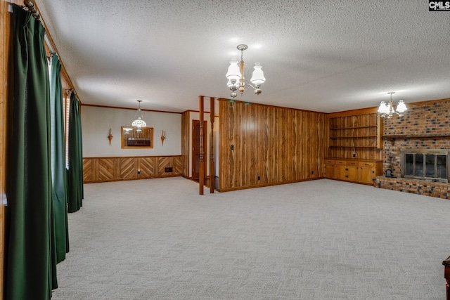 living room with light carpet, a textured ceiling, and wood walls