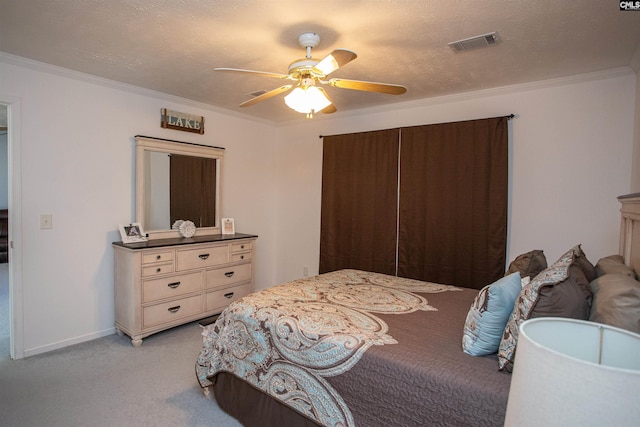 bedroom featuring crown molding, visible vents, and light carpet