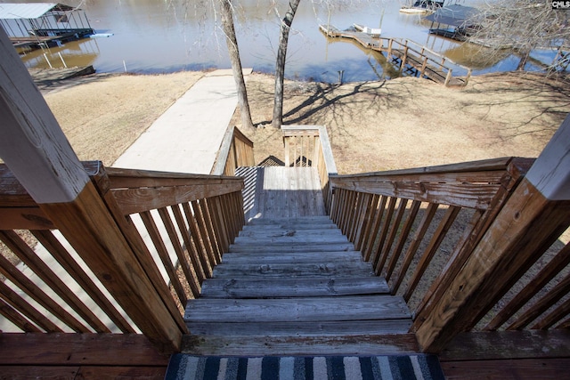 staircase featuring a water view