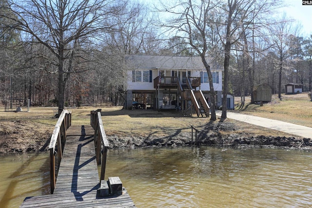 dock area with stairs and a water view