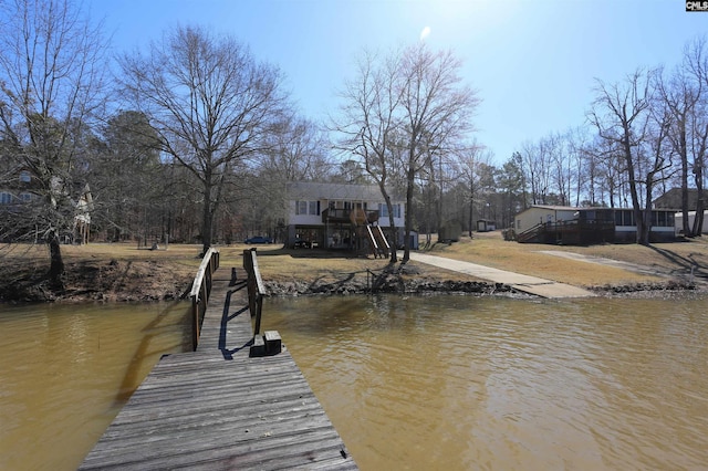 view of dock featuring stairway and a water view