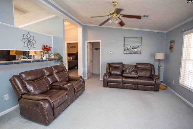 living room featuring a ceiling fan, carpet, visible vents, and ornamental molding