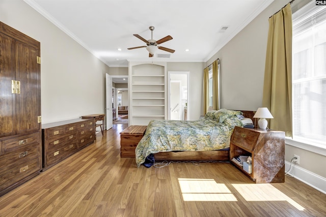 bedroom with visible vents, baseboards, light wood-type flooring, ornamental molding, and recessed lighting