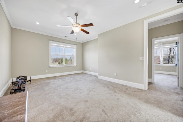 empty room featuring baseboards, carpet, and ornamental molding