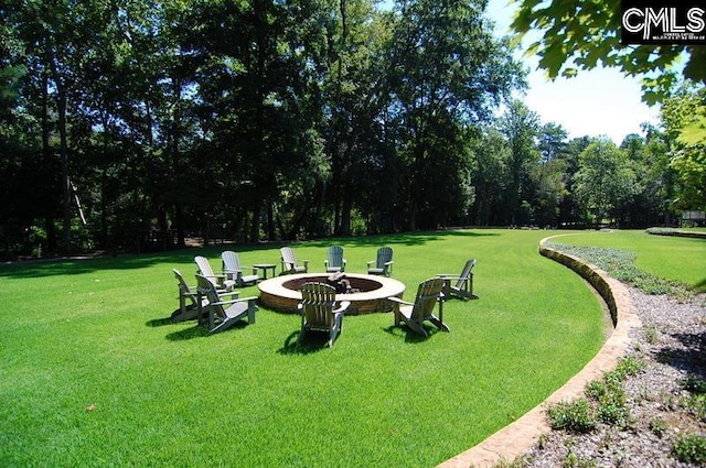 view of yard with an outdoor fire pit