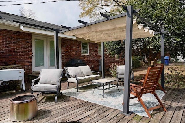 wooden deck with an outdoor hangout area and a pergola