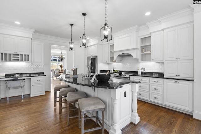 kitchen featuring white cabinetry, dark countertops, and stainless steel appliances