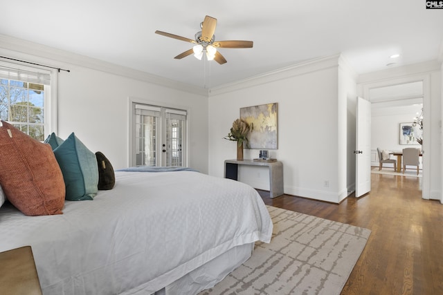 bedroom featuring ornamental molding, french doors, baseboards, and wood finished floors