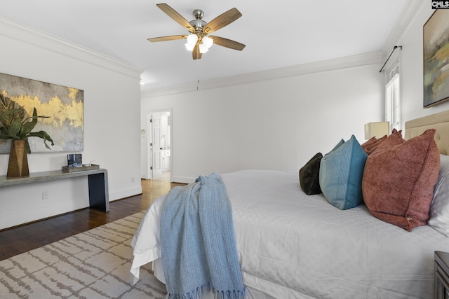 bedroom with ceiling fan, baseboards, wood finished floors, and ornamental molding