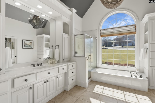 full bathroom featuring vanity, high vaulted ceiling, a shower stall, tile patterned floors, and a bath