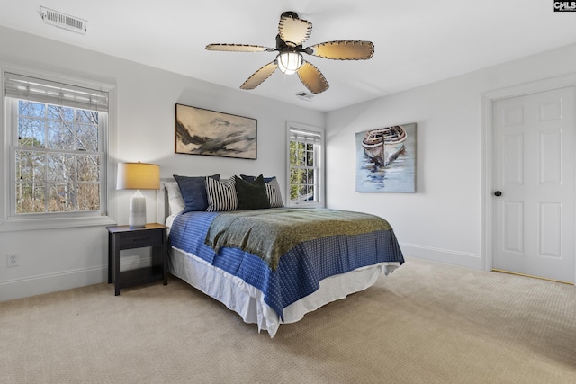 bedroom featuring baseboards, visible vents, and carpet floors