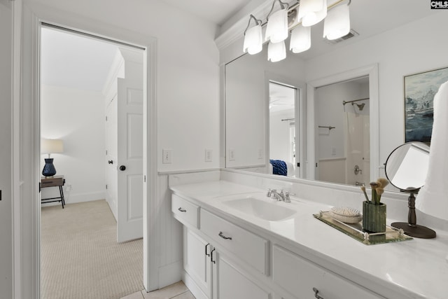 bathroom featuring a shower, visible vents, and vanity