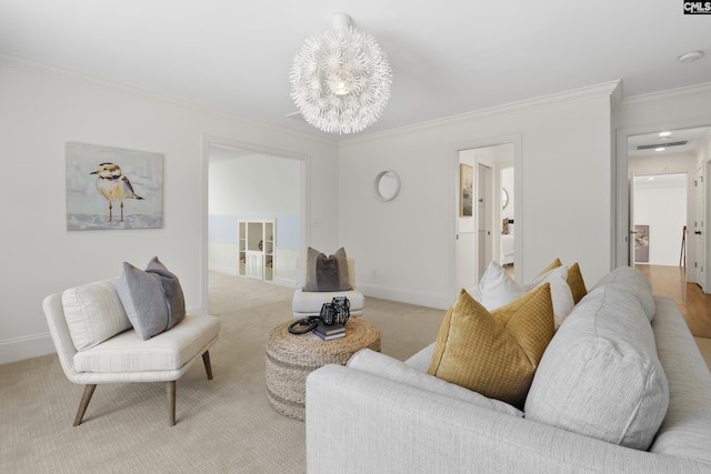 living area with a notable chandelier, light colored carpet, baseboards, and ornamental molding