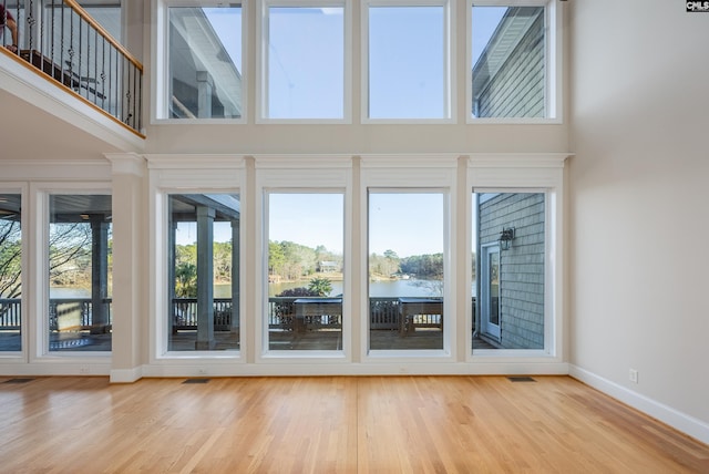 interior space featuring visible vents and a water view