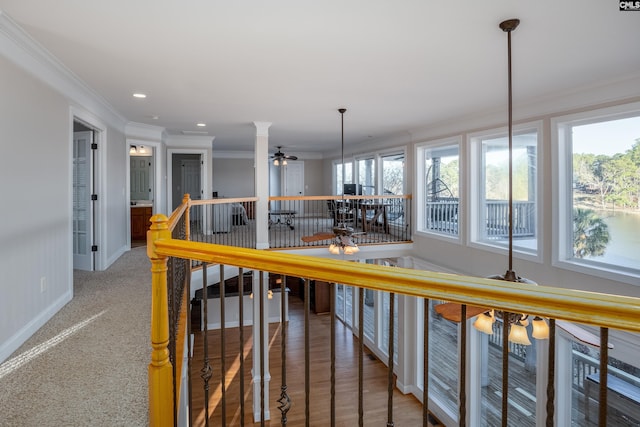 kitchen featuring baseboards, carpet, ceiling fan, ornamental molding, and recessed lighting