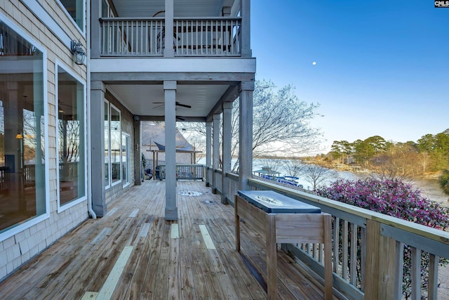 wooden deck featuring ceiling fan