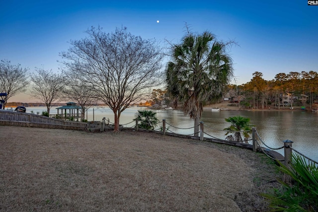 view of yard featuring a gazebo and a water view