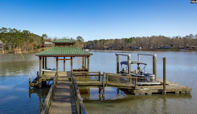 dock area with a water view and boat lift