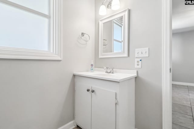 bathroom featuring vanity and baseboards