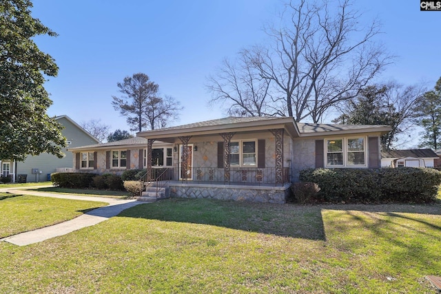 view of front of property featuring a front lawn, covered porch, and stone siding