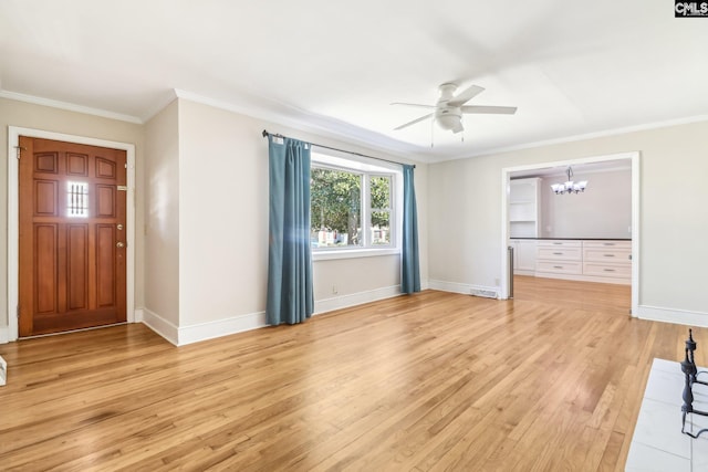 foyer featuring baseboards, light wood finished floors, crown molding, and ceiling fan with notable chandelier