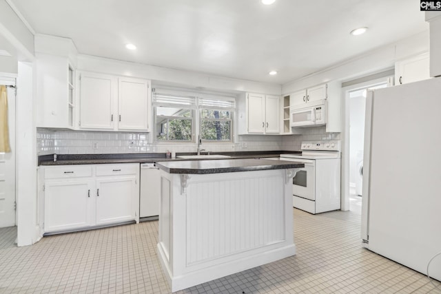 kitchen with white cabinetry, white appliances, open shelves, and a sink