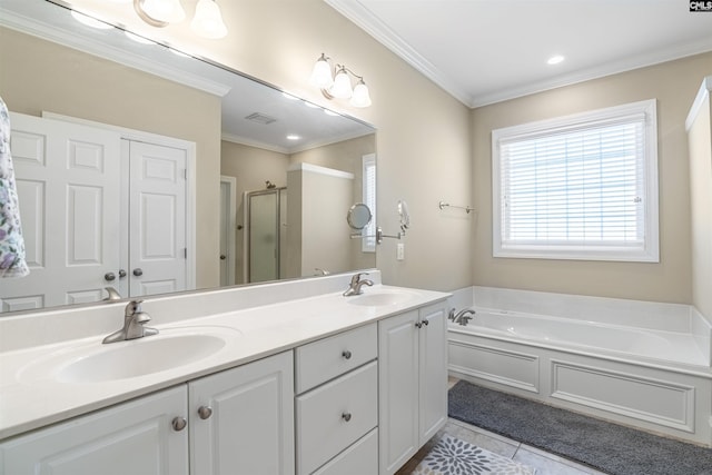 bathroom with tile patterned floors, a stall shower, crown molding, and a sink