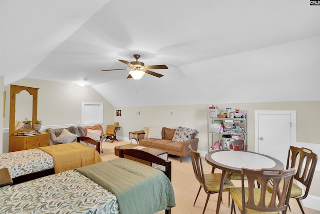 bedroom featuring vaulted ceiling, a ceiling fan, baseboards, and light carpet