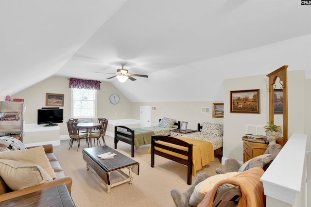 living area featuring visible vents, light carpet, a ceiling fan, baseboards, and vaulted ceiling